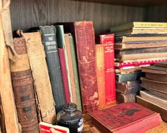 Antique leather-bound books & vintage glass ink bottle