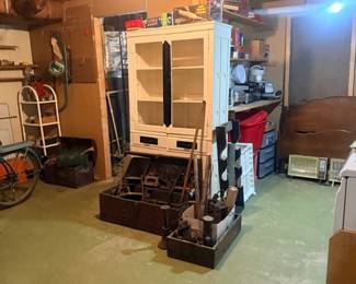 White cabinet and bicycle in basement storage area