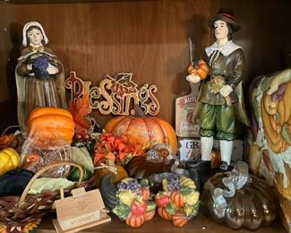 Pilgrim figurines and Thanksgiving harvest decor