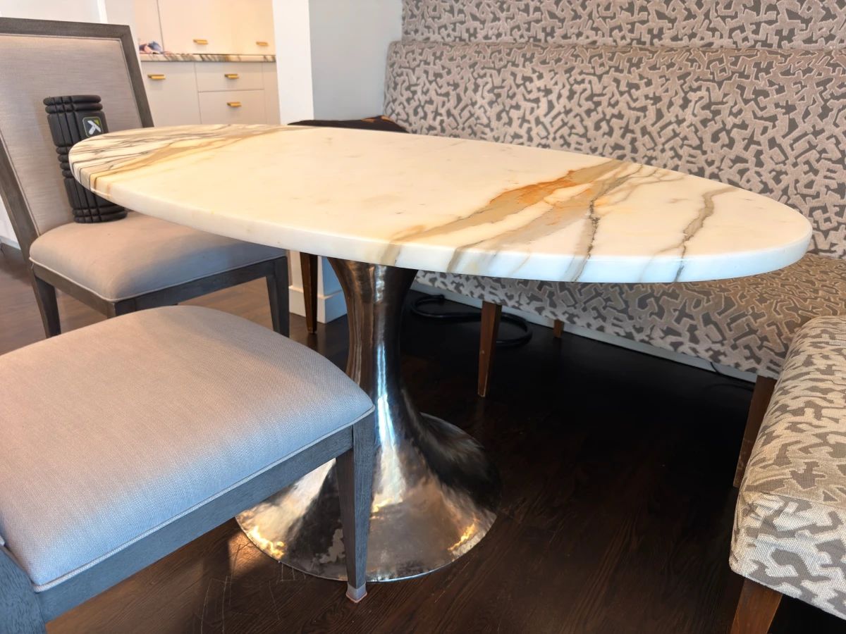 Marble dining table and upholstered chairs at an Estate Greats sale in Forest Hills, Tennessee