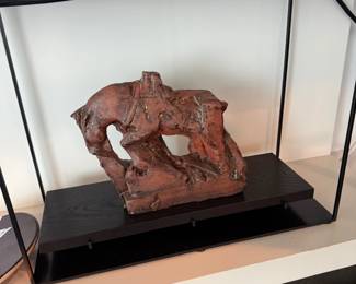 Terracotta abstract sculpture on base
