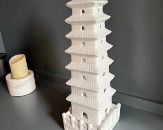 Tall white ceramic pagoda tower