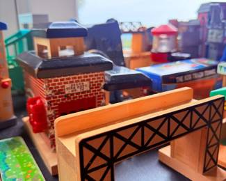 Wooden train set with bridge and buildings