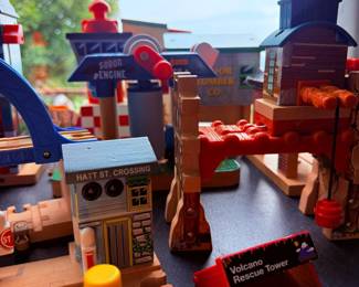 Wooden train playset with volcano rescue tower