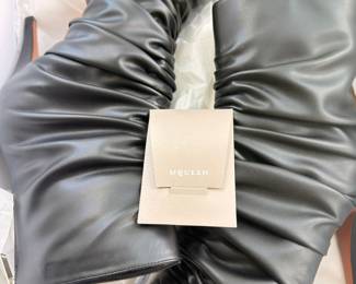 Black ruched leather knee-high boots