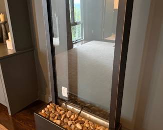 Modern fireplace with decorative stones