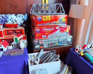 Boxed model train sets, CSX and Santa Fe