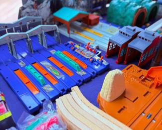 Toy train track and playset pieces