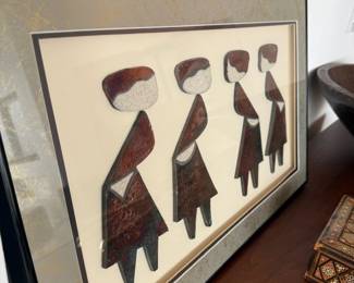 Framed African figural relief art, four women