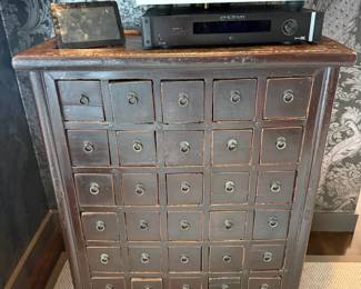 Antique multi-drawer apothecary chest with audio components