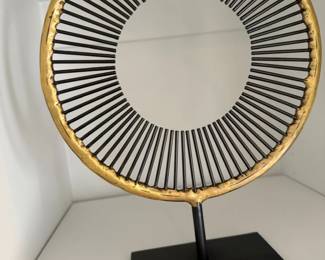 Gilt sunburst ring sculpture on stand