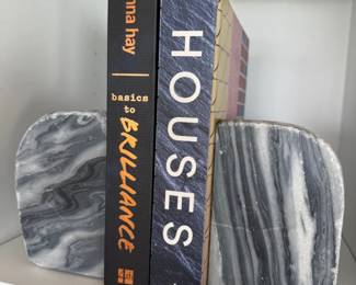 Gray marble bookends with design books