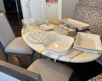 Assorted white ceramic serving dishes and platters