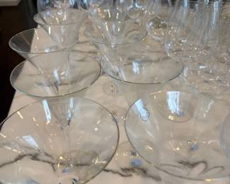 Etched crystal coupes and stemware