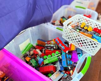 Bin of assorted toy trains