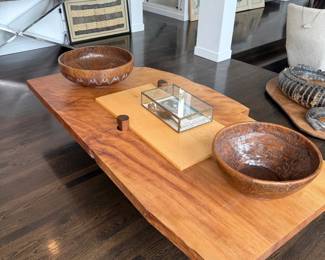 Live edge wood slab coffee table with carved bowls