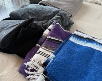 Folded throw blankets and textiles