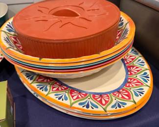Colorful ceramic dinnerware and terracotta baker