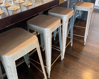 Set of industrial metal bar stools with wood seats