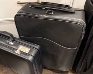 Black leather luggage and briefcase