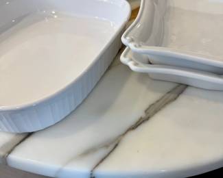 White ceramic bakers and marble serving board