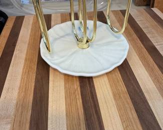 Gold kitchen utensils in marble holder