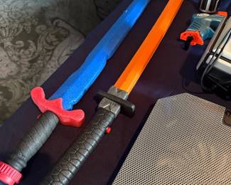 Toy foam swords and lightsaber