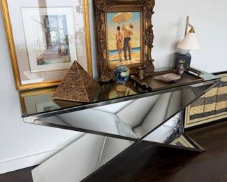 Mirrored geometric console table with decor