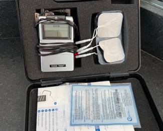 TENS electrotherapy unit in case