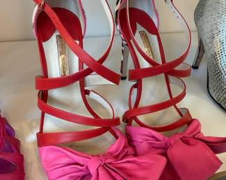 Red strappy heels with pink bow detail