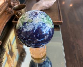Art glass globe sculpture on pedestal