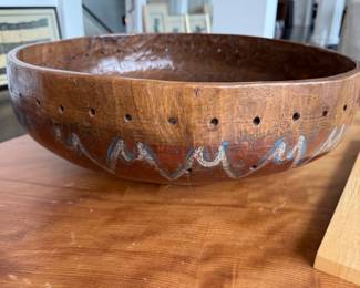 Antique wood bowl with staple repairs, pierced rim