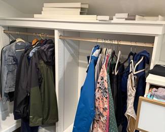 Jackets, dresses and outerwear in closet