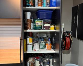 Cabinet of paint cans and supplies