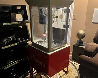CLOSE-UP OF POPCORN MACHINE. HEAVY METAL CONSTRUCTION