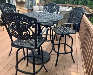CLOSE-UP OF THE FORTUNOFF CAST ALUMINUM BISTRO SET, HIGH TABLE WITH 4 CHAIRS.