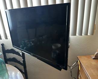 Television, Flatscreen Roku TV with wall mount