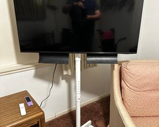 Television & stand - flat screen (less than 6 months old) Samsung