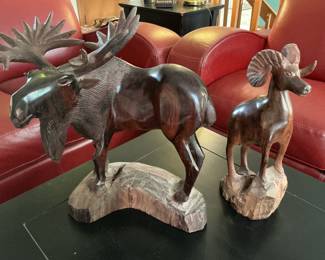 Carved longhorn sheep and moose