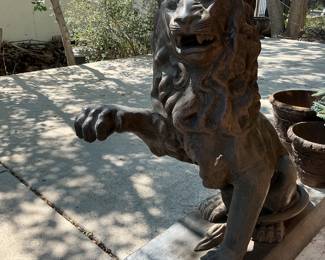 A pair of tall unique cast aluminum lions