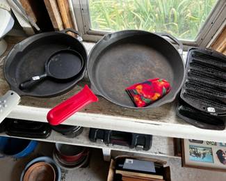 Three different size cast iron skillets and cornbread sticks - well seasoned