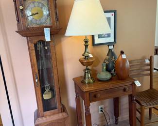 Grandfather clock, antique table, decorative vases