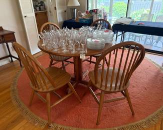 Diningroom table with 4 chairs, orange fringe rug, Candlewick