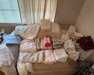 Various linens and loveseat
