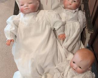 Collection of Antique Bisque Baby Dolls in Wicker Bassinet