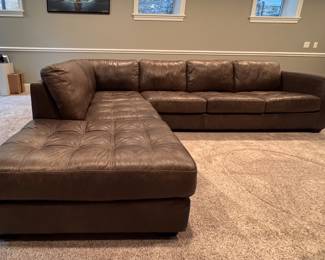 Arhaus Tufted Leather Upholstered Sectional Sofa with Left Facing Chaise Sofa. Measures 90" W x 40" D x 121" L. Photo 1 of 6.