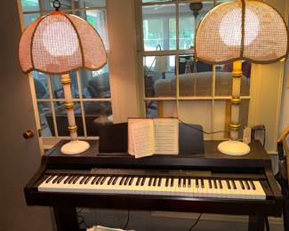 Pair of faux bamboo metal and cane lamps
