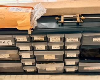 Cabinet full of clock parts, accurately described on each drawer