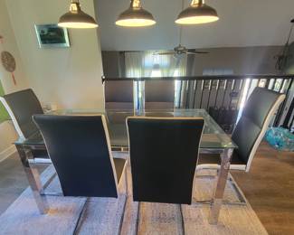 PRESALE - $200 CONTEMPORARY GLASS AND CHROME DINING TABLE WITH 6 BLACK AND WHITE CHAIRS