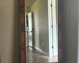 Large Full-Length Mirror with Decorative Wood Frame and Circular Motifs